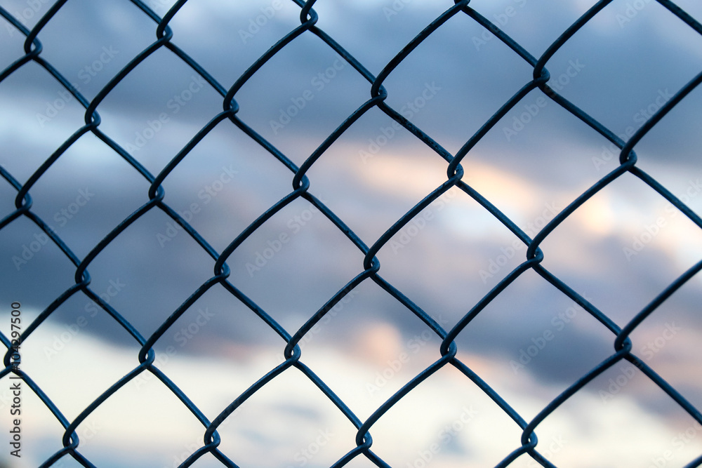 Steel Wire mesh and cloud in Evening Sky background Steel Wire mesh and cloud in Evening Sky background