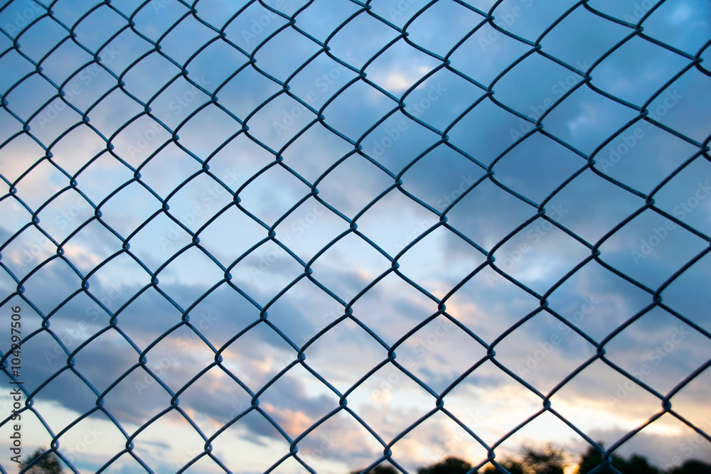 Steel Wire mesh and cloud in Evening Sky background Steel Wire mesh and cloud in Evening Sky background