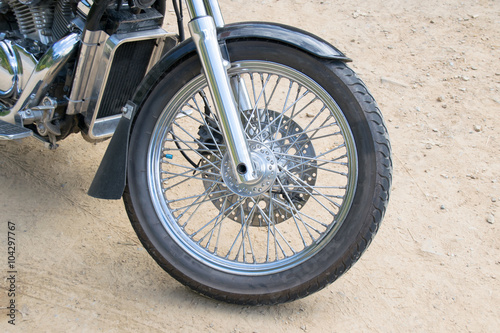 Fototapeta Naklejka Na Ścianę i Meble -  Close up front wheel motorcycle chopper  on the floor.
