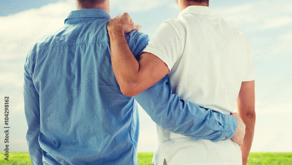 close up of happy male gay couple hugging close up of happy male gay couple hugging