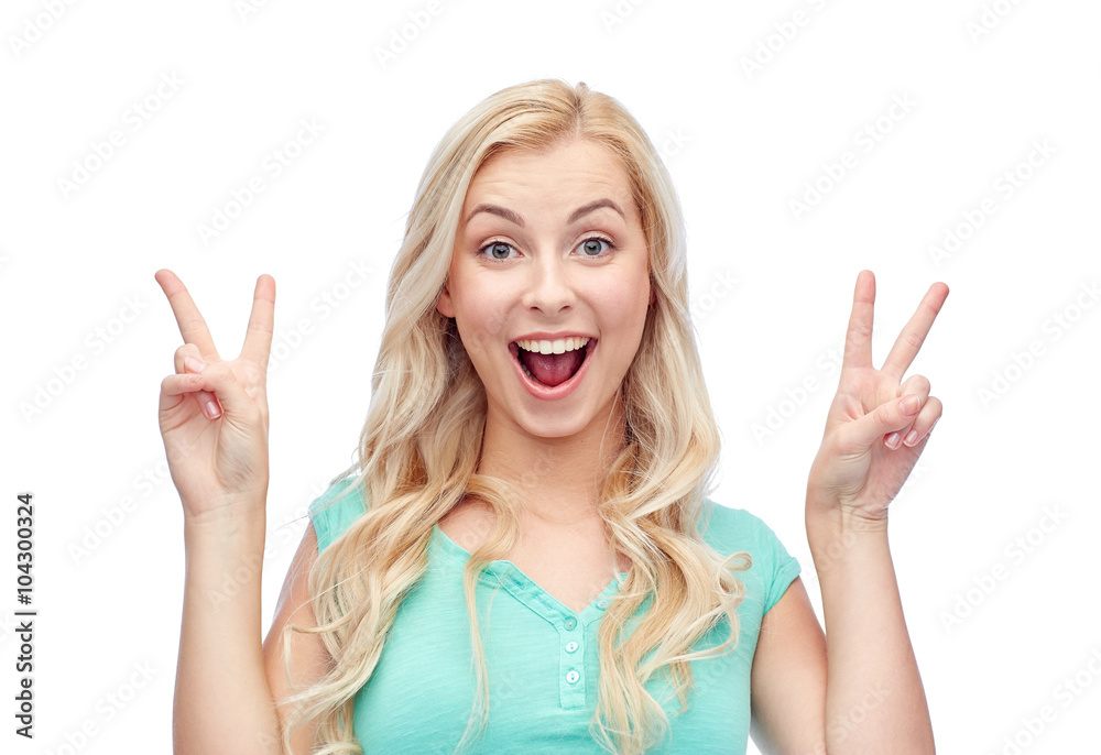 smiling young woman or teenage girl showing peace smiling young woman or teenage girl showing peace