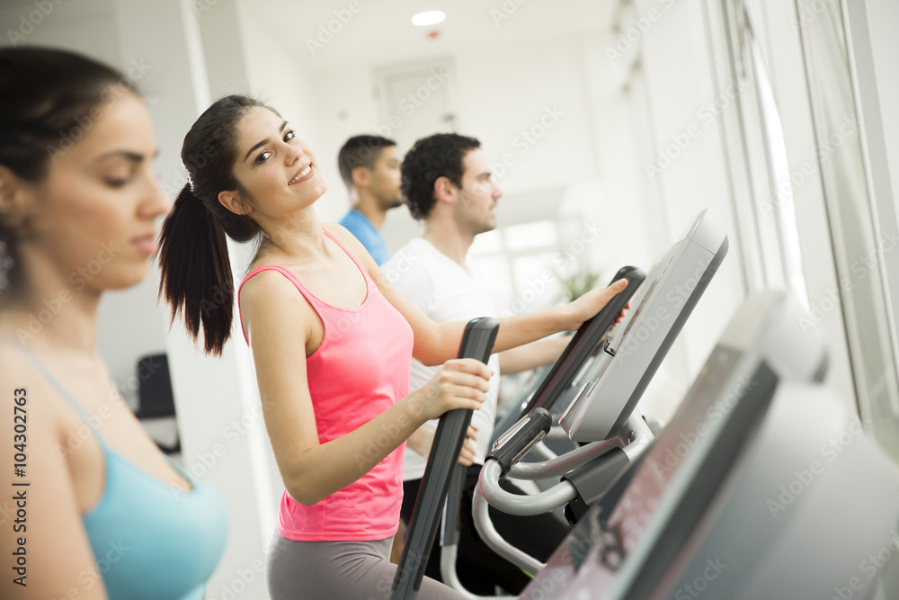 Young people training in the gym Young people training in the gym