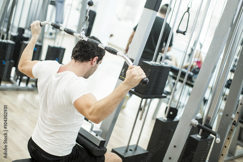 Young man training in the gym Young man training in the gym