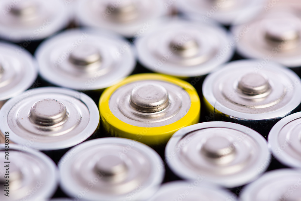One is always different - group of batteries in row pattern One is always different - group of batteries in row pattern
