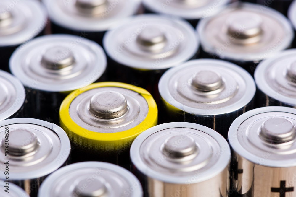 One is always different - group of batteries in row pattern One is always different - group of batteries in row pattern