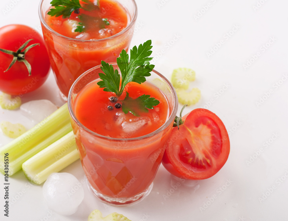 glass of fresh tomato juice on white background glass of fresh tomato juice on white background