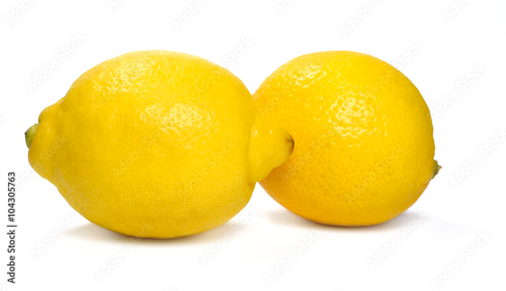 Two fresh whole lemons, isolated on white background. Two fresh whole lemons, isolated on white background.