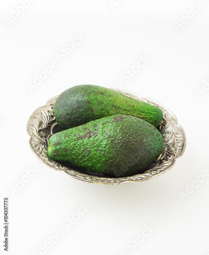 Avocado in silver plate