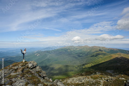 young woman practices yoga on a mountain top, Carpathian mountains © anatoliy_gleb