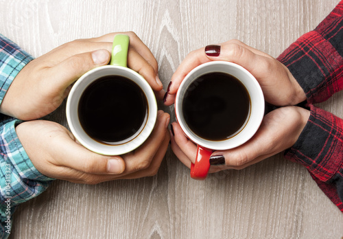 Concept of male and female hands, love and coffee 