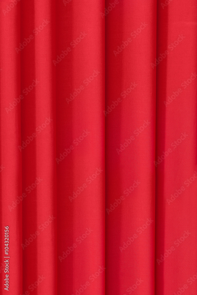 The background is draped in bright red cloth The background is draped in bright red cloth