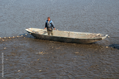 Fisherman Pulling Fishing Net