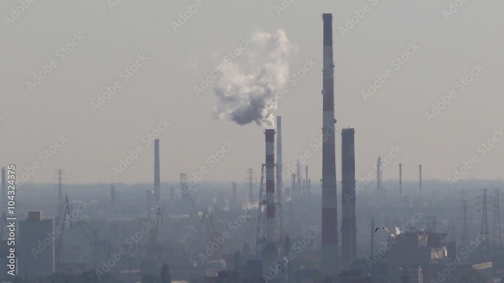 Smoke fumes from industrial chimney on the horizon Smoke fumes from industrial chimney on the horizon