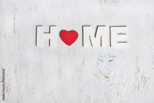 the word home made of wooden letters on a white background old