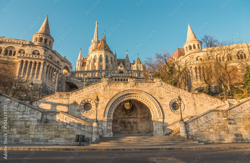 Sunlit Fisherman's Bastion in Budapest, Hungary at Sunrise. View from below.