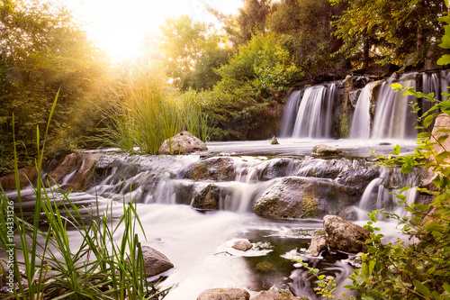 Fototapeta Naklejka Na Ścianę i Meble -  Rushing waterfall at sunset