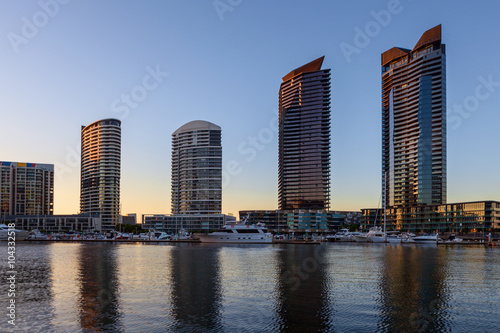 Residential high rise buildings and Yarra waterfront with docked Yachts in Docklands  Melbourne  early morning.