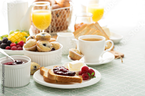 Fresh and bright continental breakfast table Fototapeta