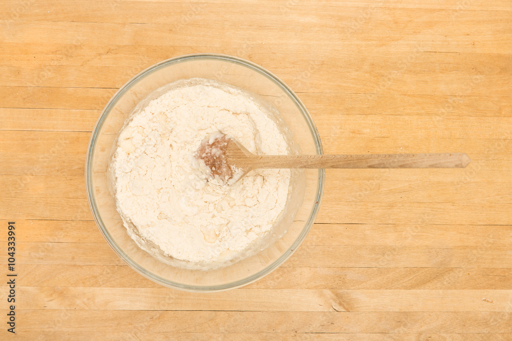 Mixing bowl with flour and mixture Mixing bowl with flour and mixture