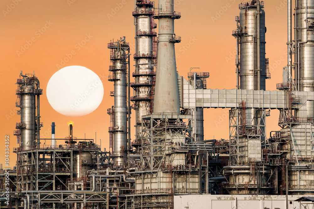 Oil refinery isolated with sunset.