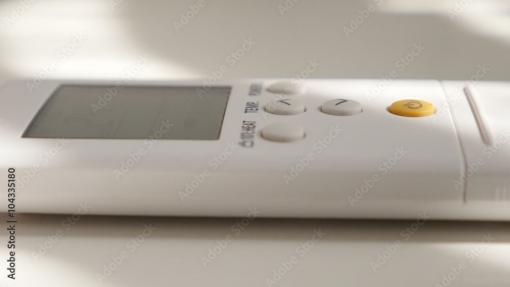 Lowering room temperature on air conditioner remote control close-up 4K 2160p UltraHD footage - Finger on air conditioning remote control button 4K 3840X2160 UHD video Lowering room temperature on air conditioner remote control close-up 4K 2160p UltraHD footage - Finger on air conditioning remote control button 4K 3840X2160 UHD video