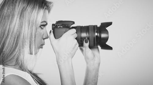 Beautiful woman with camera.