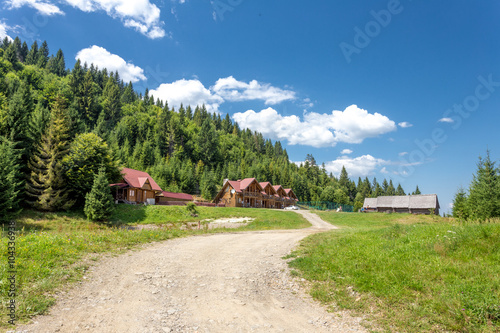 Wooden house on forest background