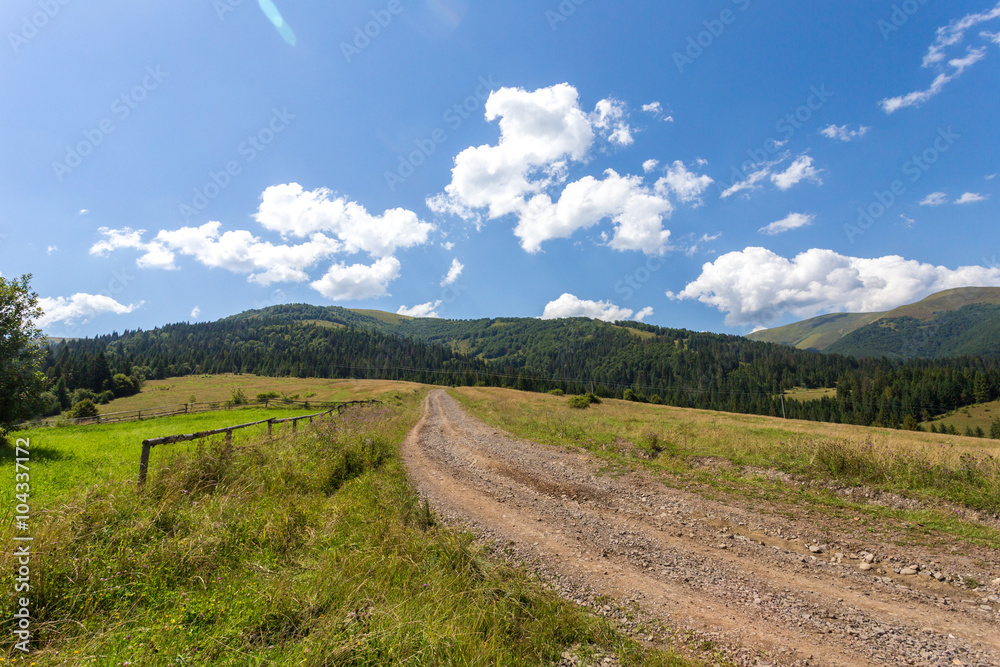 Road on the hill on mountain background