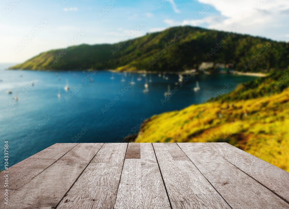 Wood floor top on blurred blue sea and island view point