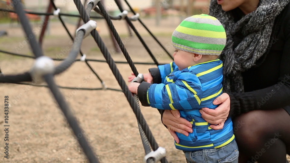 Happy child playing with his mother on the playground
Happy child playing with his mother on the playground