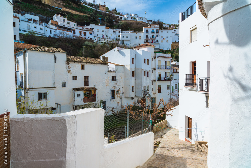 Fototapeta premium Setenil de las Bodegas is a town in the province of Cadiz, Spain, famous for its dwellings built into rock overhangs above the Rio Trejo. Andalusia. Spain