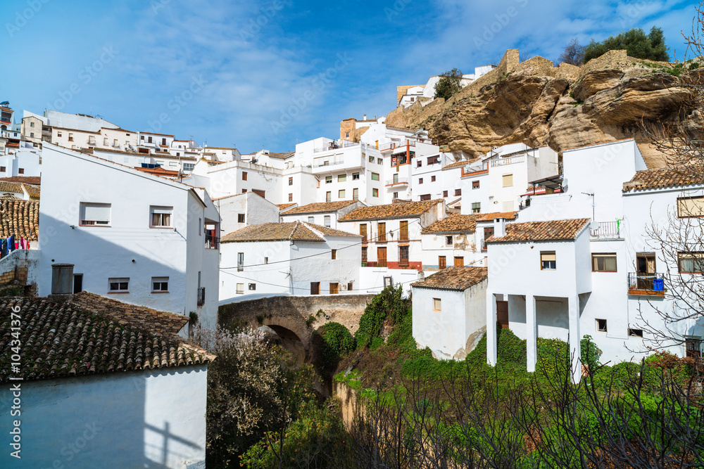 Setenil de las Bodegas is a town in the province of Cadiz, Spain, famous for its dwellings built into rock overhangs above the Rio Trejo. Andalusia. Spain