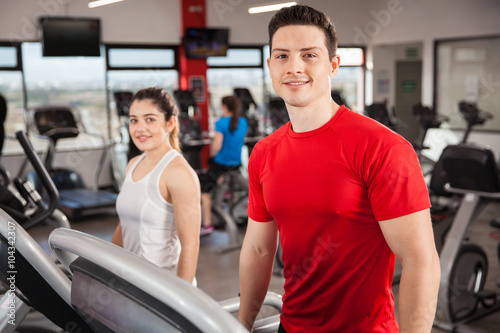 Good looking couple exercising at the gym