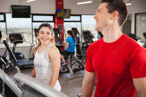 Young couple flirting at the gym