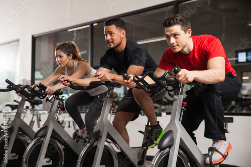 People doing some spinning at a gym photo