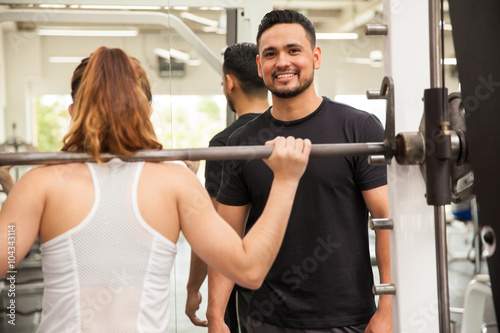 Handsome trainer working at the gym