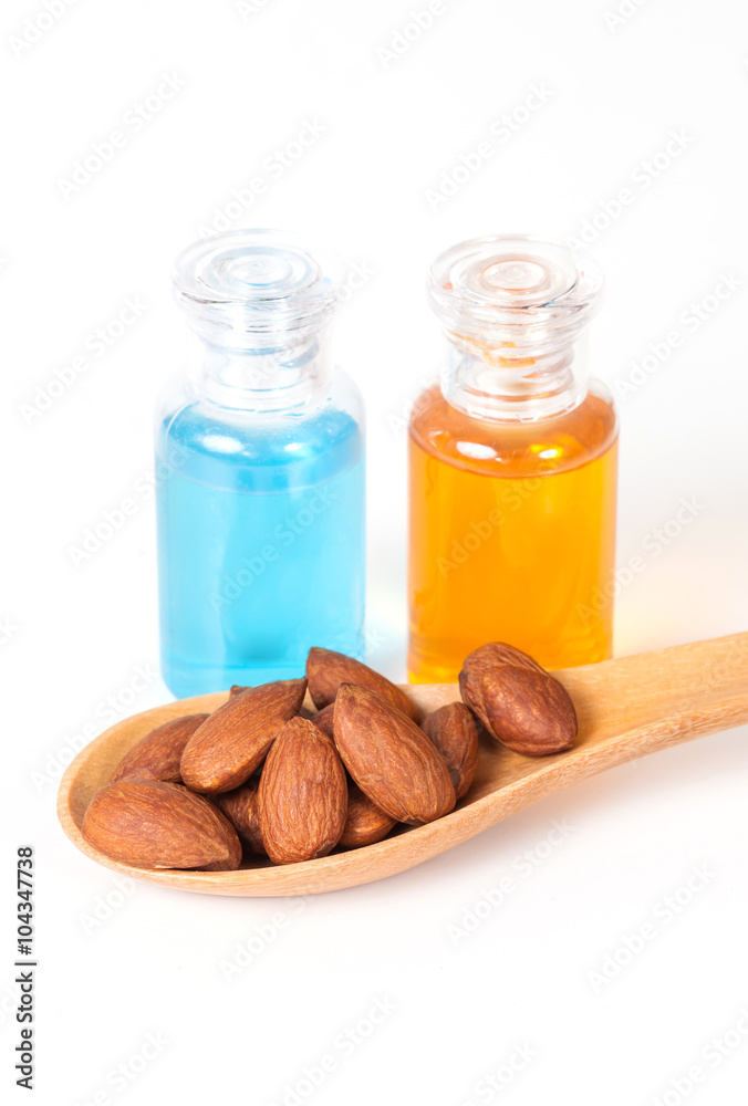 Almonds on wood and oil bottle Almonds on wood and oil bottle