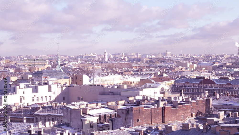 Aerial shot of city in special hue. Roofs, snow, clouds. Aerial shot of city in special hue. Roofs, snow, clouds.