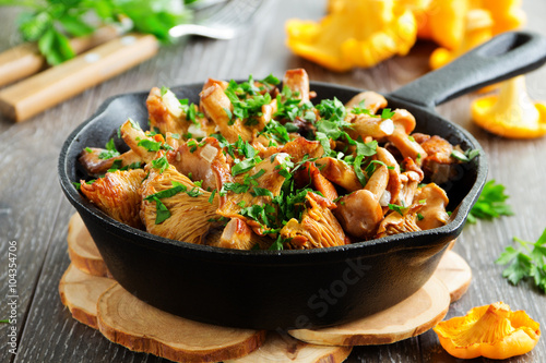 Fried chanterelle mushrooms in a creamy sauce photo
