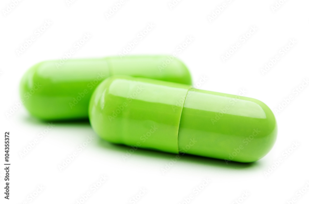 two green capsule isolated