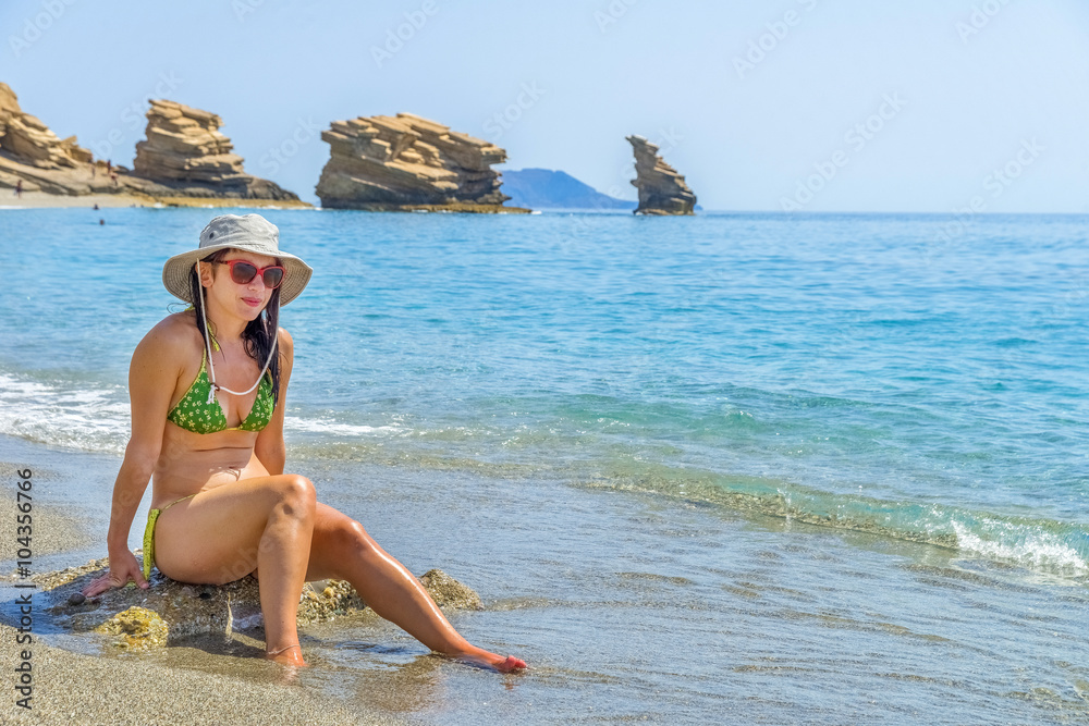 Fototapeta premium Young pretty woman in one of the most beautiful beaches in the w
