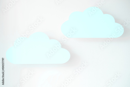 beautiful paper blue clouds on a light background