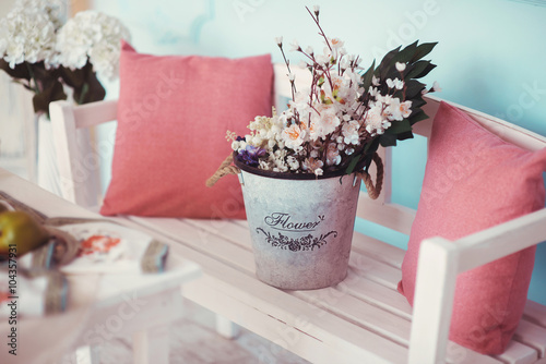 The room is beautifully decorated with colorful flowers