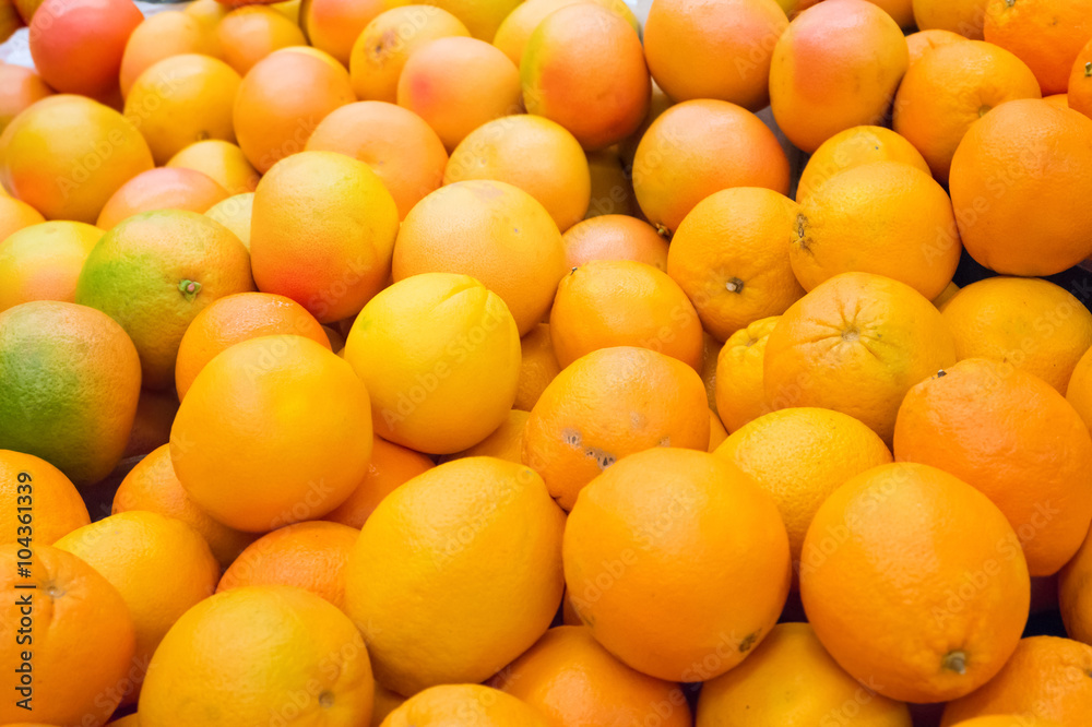 Pile of fresh oranges and mandarins