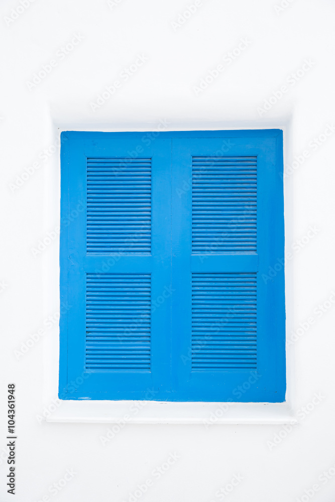 blue closed windows on white wall blue closed windows on white wall