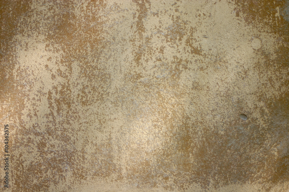 Texture of old yellow paint on a small area of the surface