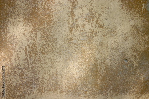 Texture of old yellow paint on a small area of the surface