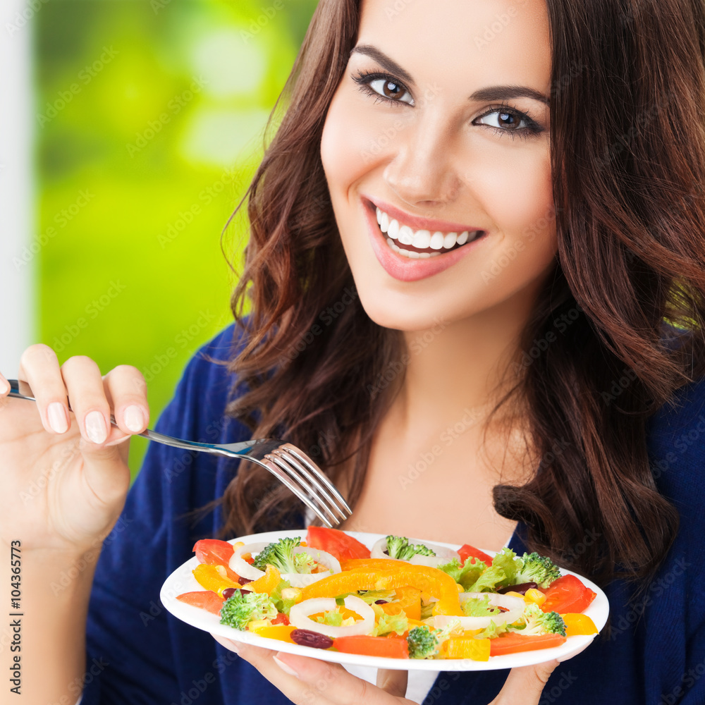 brunette woman with vegetarian vegetable salad brunette woman with vegetarian vegetable salad