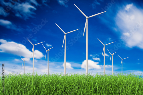 3d rendered wind turbines in grass field