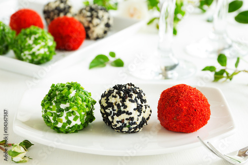 Snack-balls of goat cheese with spices.